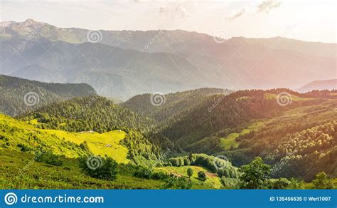 The View From The Height Of A Green Mountain Valley With Residential