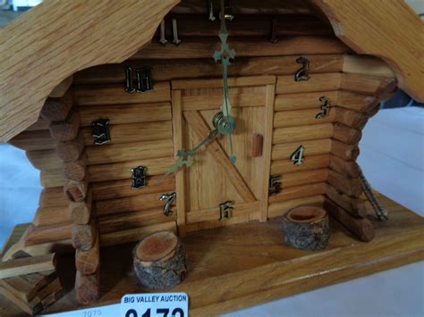This spacious cabin, ensuring lots of natural light due to its enormous windows and doors. LOG CABIN CLOCK - Big Valley Auction