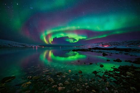 Aurora Borealis Over Lake In Norway