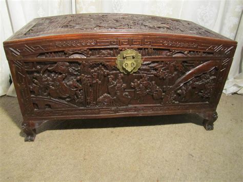 This wooden storage chest with two safety hinges allows for safe opening and closing while storing everything in one place. Large Carved Oriental Camphor Wood Chest - Antiques Atlas