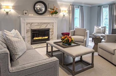 A Large Fireplace With White Mantle And Marble Surround Transitional