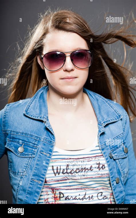 Pretty Brunette Teenage Girl With Sunglasses Studio Shot Stock Photo