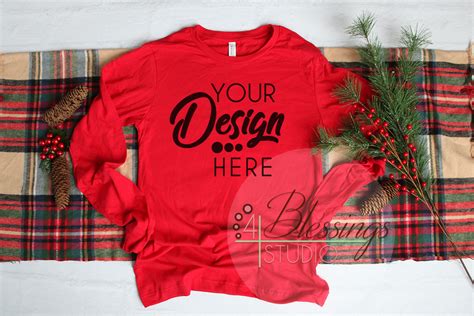 Here is a more simplistic alternative of a female model posing in front of a fully modifiable backdrop. Christmas Long Sleeve Tshirt Mockup Red Bella Canvas 3501