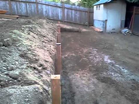 How to level a yard turf removal. Sloping yard we made to levels an put wood wall - YouTube