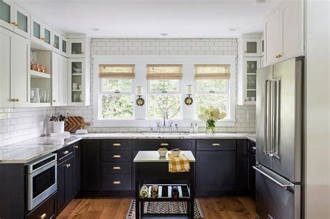 Black kitchen cabinets in a small space. Black Lower Cabinets with Brass Cup Pulls - Transitional ...