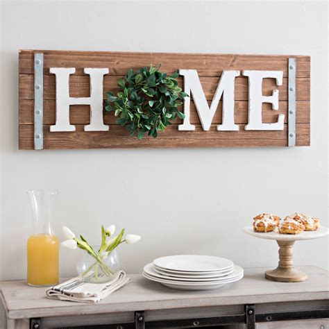 'modern' coastal or farmhouse style is a bit different from what i picture as a more traditional subway tile, painted paneled walls, stone (marble or quartz!) counters, wood beams like any home, you can decorate a modern coastal farmhouse with a mix of. Home Wreath Wooden Wall Plaque | Kirklands | Farmhouse wall decor, Wall decor design, Farmhouse ...