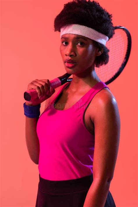 Vertical Image Of African American Female Tennis Player In Pink Neon