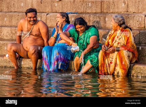 Hindu Pilgrims Bathing In The Holy River Ganges Varanasi Uttar