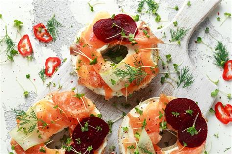 People all around the world enjoy the versatility of this smoked fish. Smoked Salmon Bagel Toasts With Soft Cheese, Cucumber Ribbons And Beetroot And Dill, Cress Salad ...