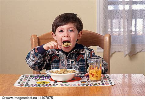 Young Boy Eating Breakfast Young Boy Eating Breakfastcarbschildchild