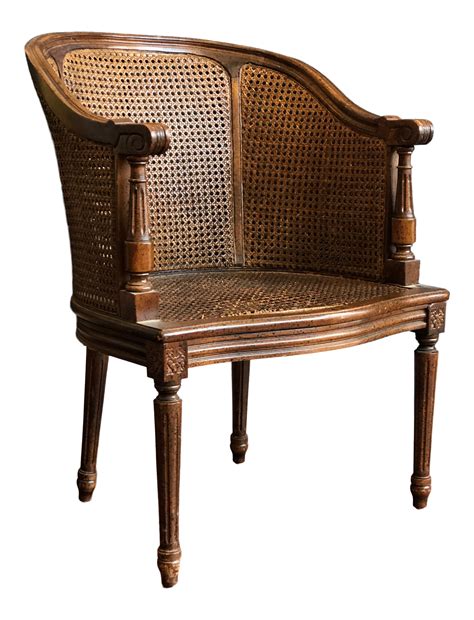 Vintage Caned Barrel Back Chair On Rustic Dining