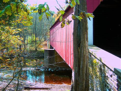 Red Wooden Covered Bridge Crossing Over Creek Loves