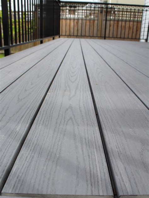 Turn your deck railing into a bar for plates and drinks. New TimberTech Composite Deck Construction in Vancouver