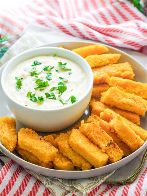 Using parchment paper, lift polenta out of tin and cut into chips about 11/2cm (2/3in) wide. Crispy Polenta Fries with Roasted Garlic Aioli - Zen & Spice