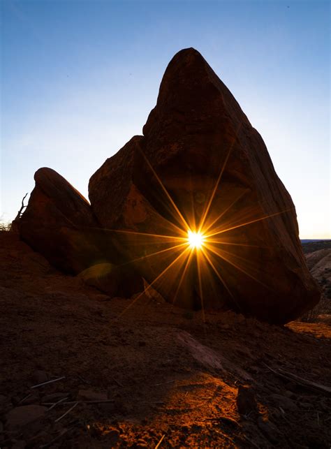 The Sun Shining Through A Gap In The Rocks At Arches National Park