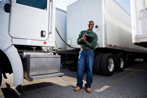 African American Truck Driver With Clipboard Stock Photo Download
