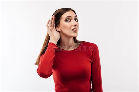 Young Pretty Brunette Woman Holding Hand Near Ear Trying To Listen