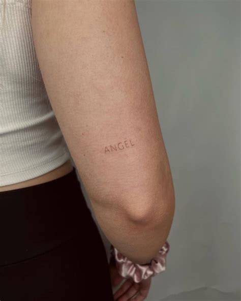 Word Angel Tattooed On The Tricep