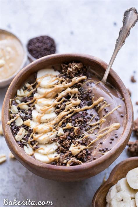 A Bowl Filled With Ice Cream Chocolate Chips And Bananas Next To Some