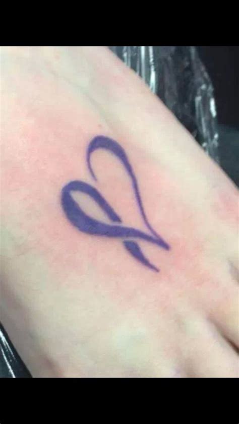 Right Ankle Purple Ribbon Tattoo In The Shape Of An E For Epilepsy