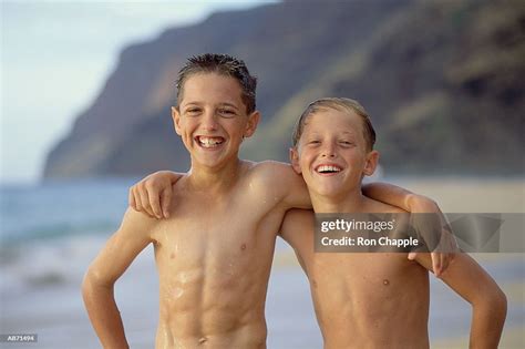 Two Boys At Beach High Res Stock Photo Getty Images
