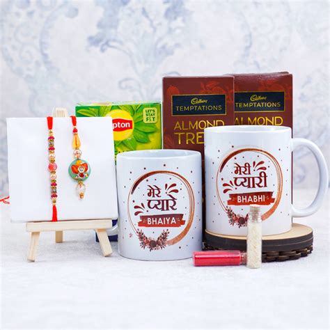 Send Set Of Bhaiya Bhabhi Rakhi With Green Tea Mugs N Chocolates Online