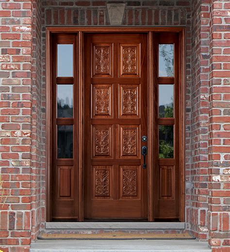 A wooden front door showcasing glass panel insets and a stylish chrome handle. Hand Carved Doors