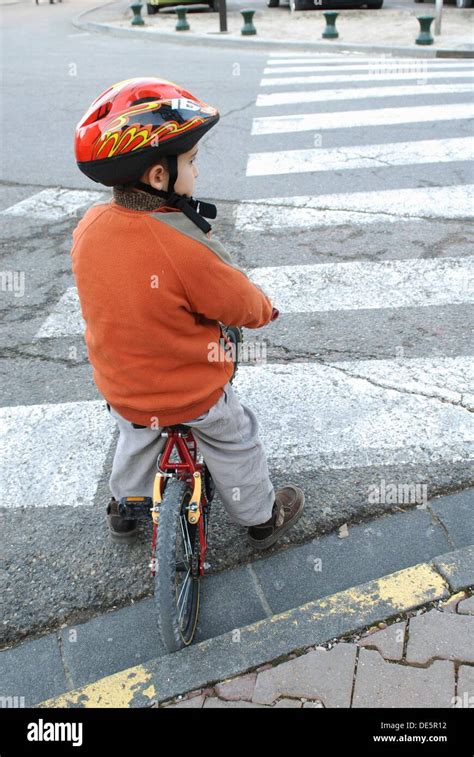 Child Biking Respecting The Highway Code Stock Photo Alamy