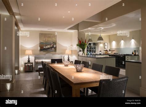 Modern Dining Room And Kitchen At Night Stock Photo Alamy
