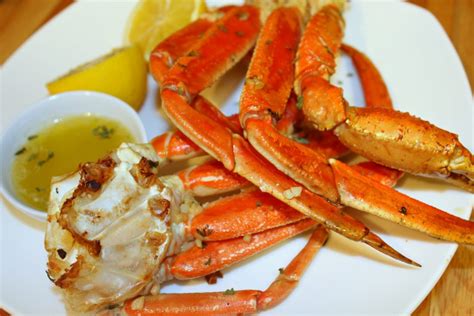 perfectly baked crab legs with spicy garlic butter forks n flip flops