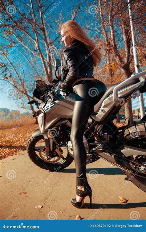 Attractive Young Woman In Black Leather Outfit With Classic Style