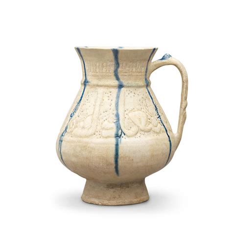 bonhams a kashan pierced and incised blue and white pottery jug persia 12th 13th century