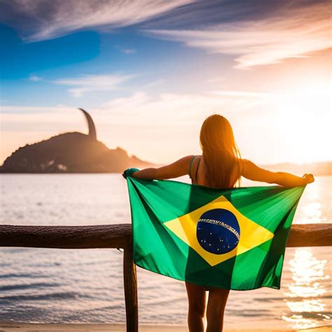 Uma Garota Segurando A Bandeira Do Brasil Foto Premium