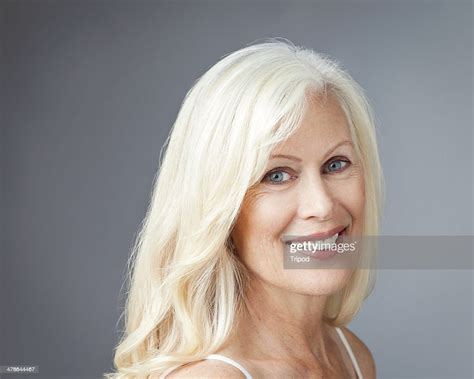 Mature Woman Smiling Portrait High Res Stock Photo Getty Images