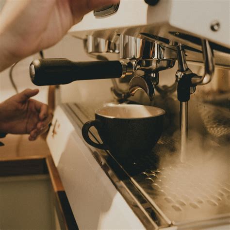Barista Preparing Coffee On Coffee Machine · Free Stock Photo