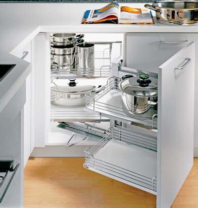 This is a similar concept to the lazy susan, only with some slight angling your cabinets correctly will help you get the most out of every inch of your kitchen. When you open the cabinet door, the shelves behind pull ...