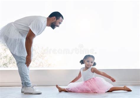 ballerina girl father and daughter dancing for fun and learning ballet dance and bonding at