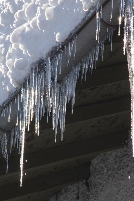 Icicles On Snow Covered Roof Free Image Download