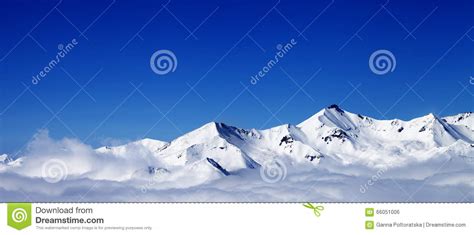 Panoramic View Of Winter Snowy Mountains Under Clouds At Nice Da Stock