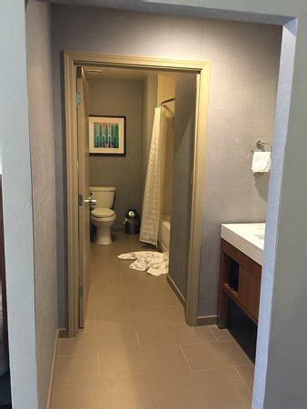 In this entryway, a basic ikea besta unit offers both closed storage and an open surface for keeping mail and small items like keys.since it doesn't rest on the floor, there's also room underneath for things like shoes. Bathroom. Toilet/tub area has door but sink area has no ...