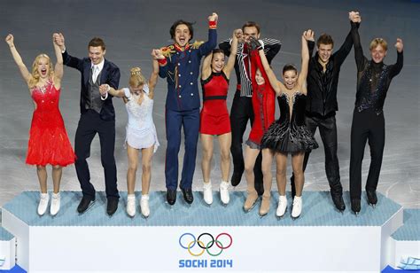 The Russian Figure Skating Team Steps Onto The Podium At The Sochi 2014