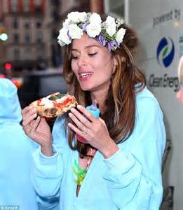 Nicole Trunfio And Jessica Hart Eat Pizza In Blue Onesies On The Street