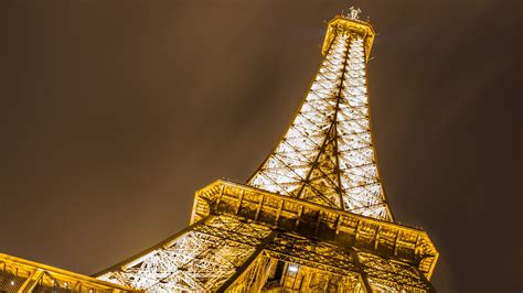 Golden Lights Of The Eiffel Tower Wallpaper Backiee