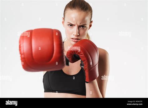Image Of Frowning Strong Woman Wearing Tracksuit And Boxing Gloves