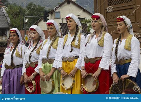 Group Of Traditional Dressed Bosnian Girls In Front Of Sebilj Fountain