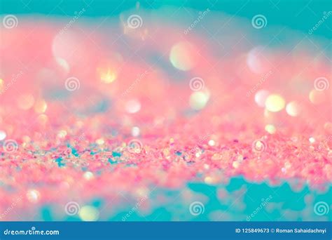 Pink Sparkles On A Blue Background Defocused Abstract Background For