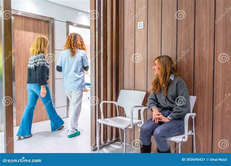 Nurse Taking A Patient From The Waiting Room Stock Image Image Of