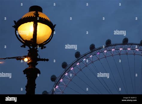 London Eye Ferris Wheel On The Banks Of The Thames River London
