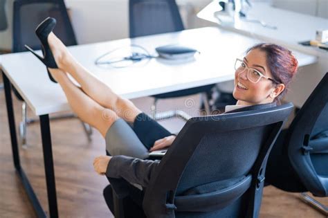 Business Woman Sitting With Her Legs Crossed On The Desk Stock Image Image Of Friendly