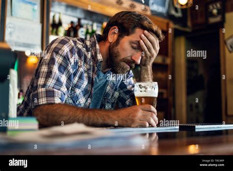 Sad Man Sitting In Beer Bar Stock Photo Alamy